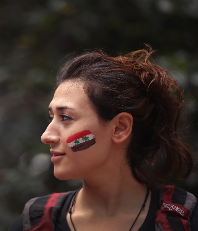 Rahaf Abuobeid, who came to the US from Syria seven months ago, participates in a protest against US intervention in Syria in Chicago