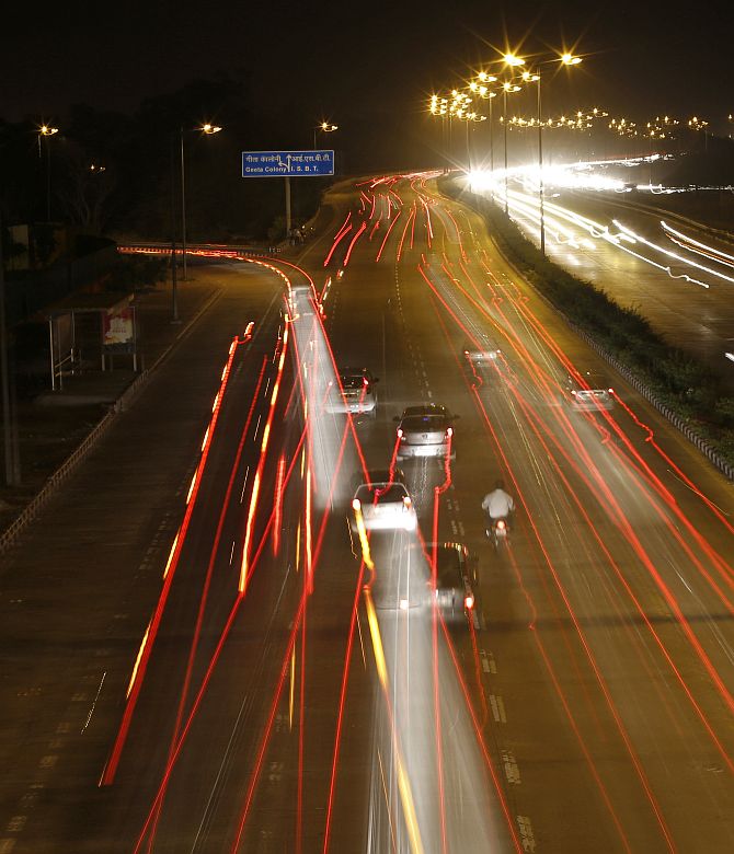 Vehicles drive on a road in New Delhi