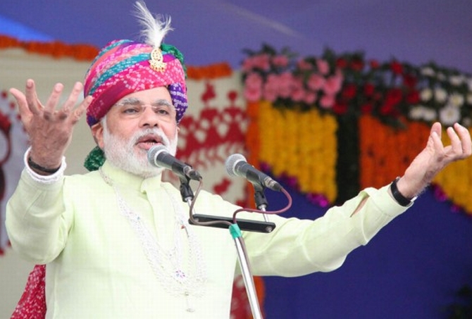 Chief Minister Narendra Modi addresses his supporters in Gujarat's Chotta Udaipur