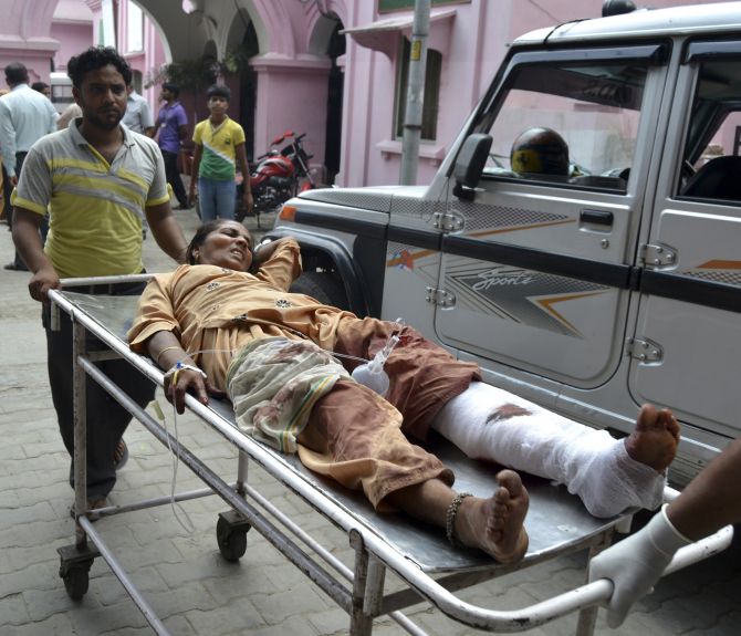 A woman who was injured in communal clashes is rushed to a hospital in Muzaffarnagar on Wednesday.