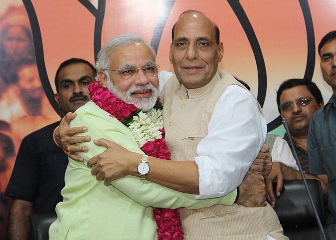 Gujarat CM Narendra Modi embraces BJP chief Rajnath Singh after his annoucement as the party's PM nominee 