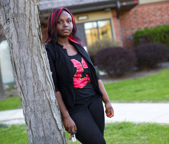 Quita Puchalla, 21, poses outside her apartment in Milwaukee.