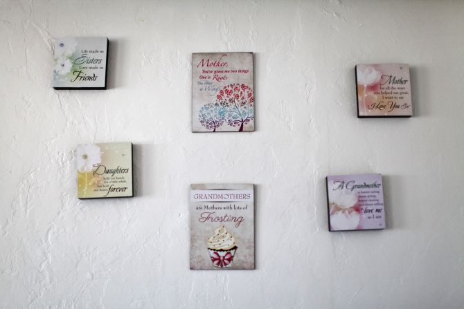 Decorative sayings are pictured on a wall inside the home of Nicole Eason in Tucson, Arizona 
