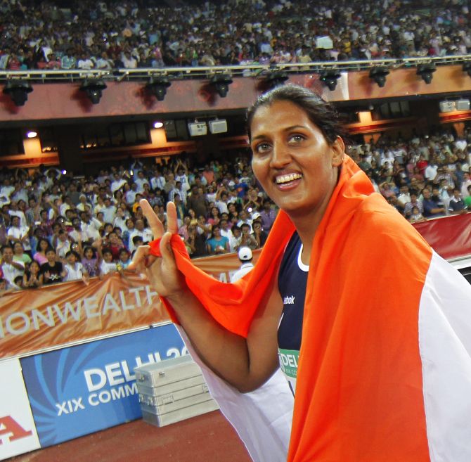 Krishna Poonia celebrates winning gold for the women's discus at the Commonwealth Games in New Delhi