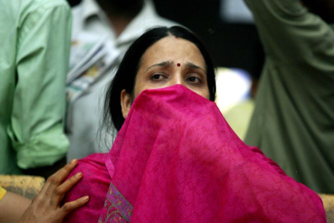 A woman mourns the death of her husband who was killed in the 2006 Mumbai train serial blasts