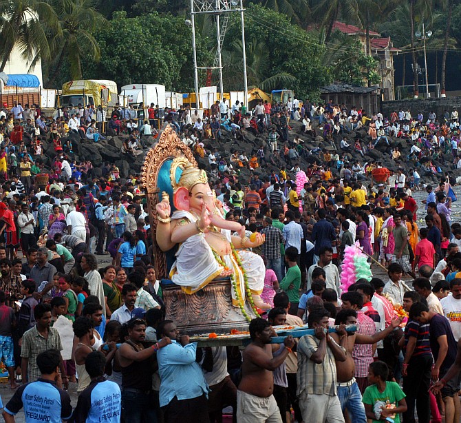 Devotees immerse a Ganesh idol at Dadar chowpatty, Mumbai