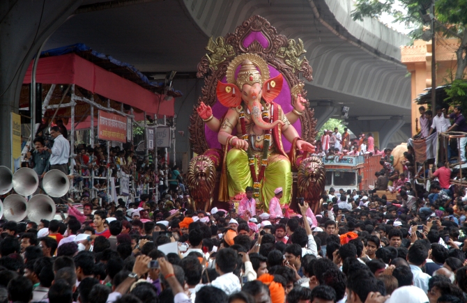 Hundreds of devotees gather near Hindamata as the Ganesh idol from the Tejukya Mansion area in Lalbaug begins his final journey