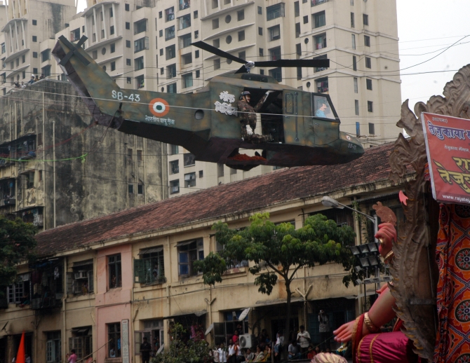 A replica of a helicopter is seen in Lalbaug as the festivities begin on the last day of Ganeshotsav
