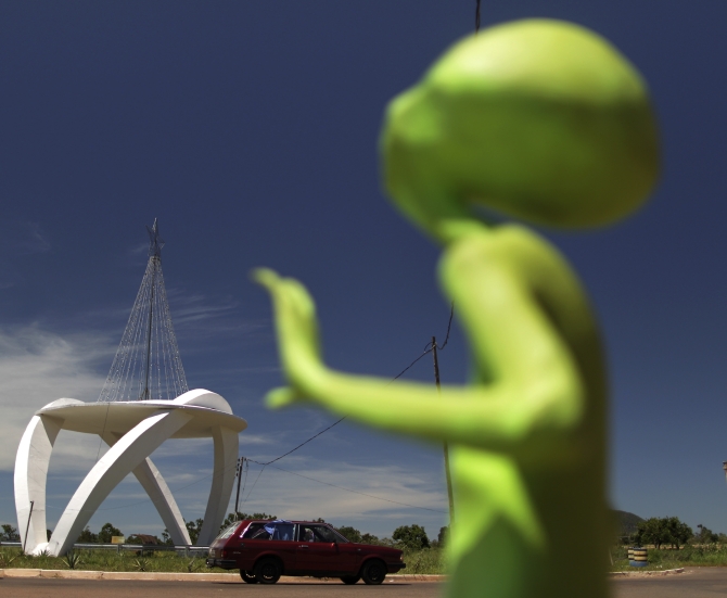 DATE IMPORTED:December 20, 2012An alien figurine stands near the spaceship-shaped entrance to the city of Alto Paraiso de Goias, central Brazil