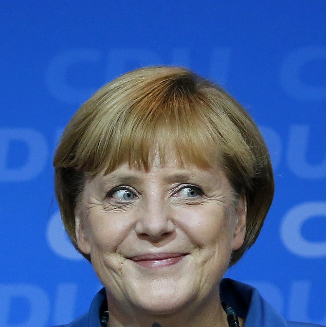 German Chancellor and leader of the Christian Democratic Union Angela Merkel smiles as she addresses supporters at the party headquarters in Berlin