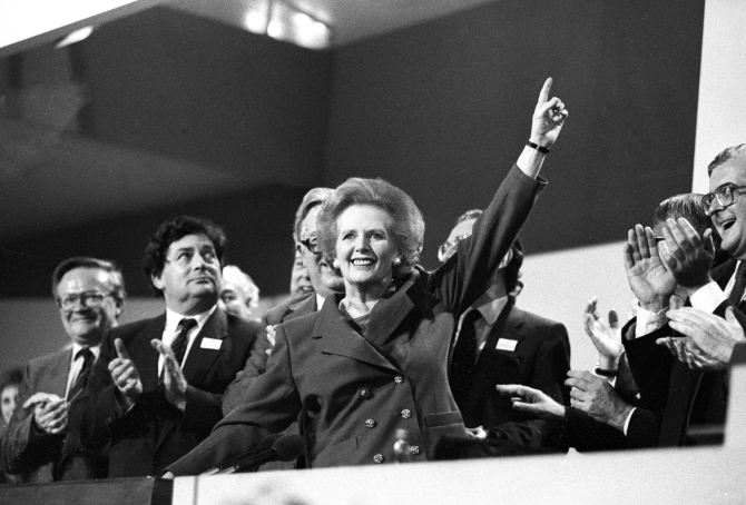 Margaret Thatcher points skyward as she receives standing ovation at Conservative Party Conference on October 13, 1989