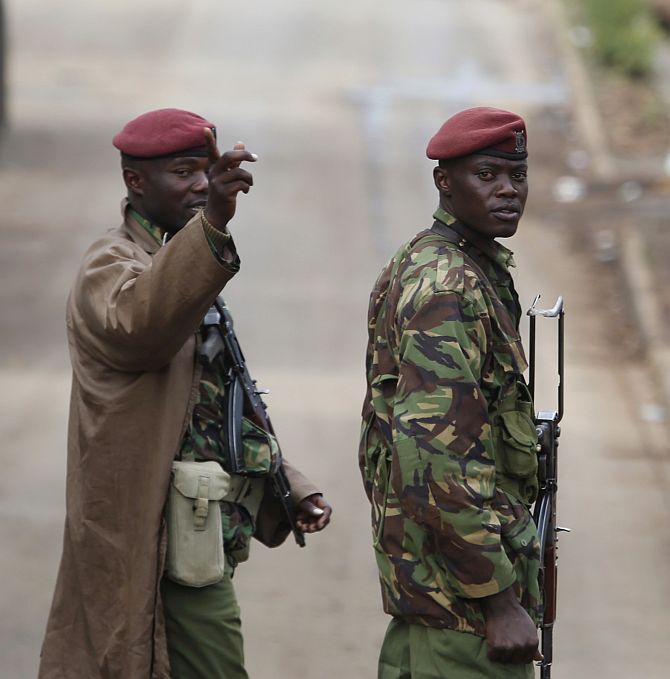A Kenyan soldier gestures near Westgate shopping centre in Nairobi