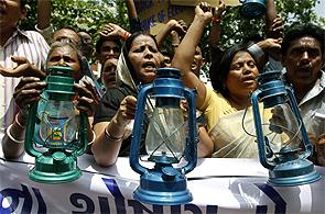 People protest the hike in electricity rates in Ahmedabad.