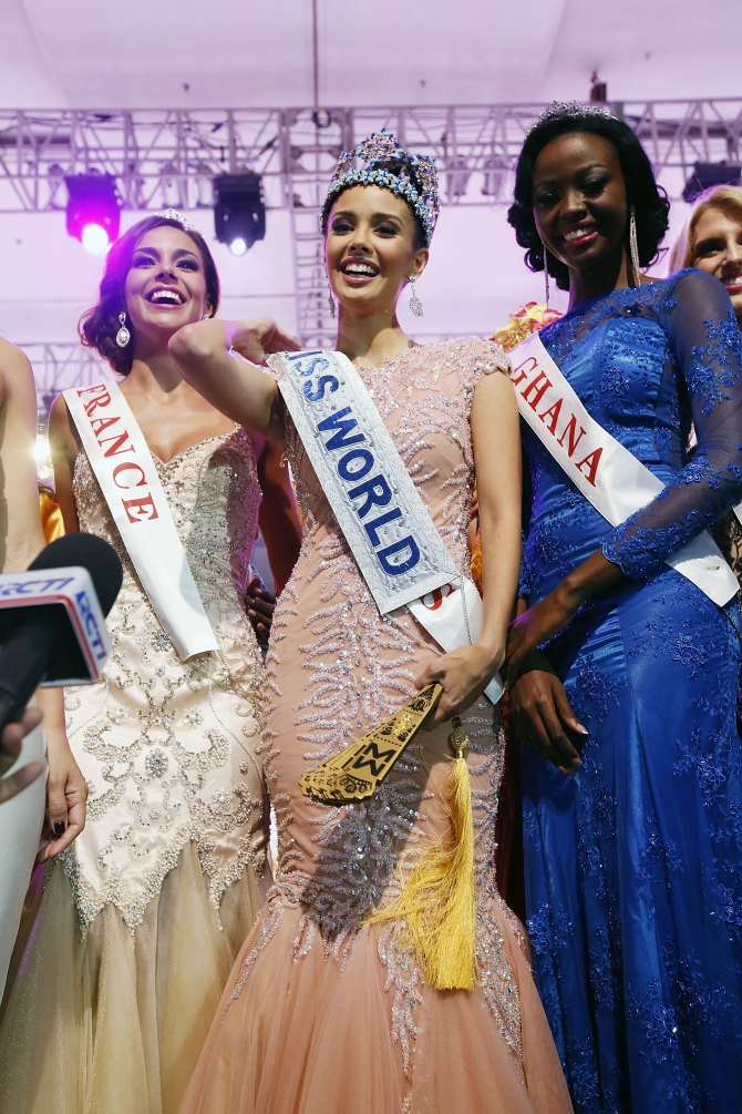 Miss Philippines, Megan Young poses with runner-up Miss France, Marine Lorphelin (L) and second runner-up Miss Ghana, Carranzar Naa Okailey Shooter (R) after she was crowned Miss World 2013