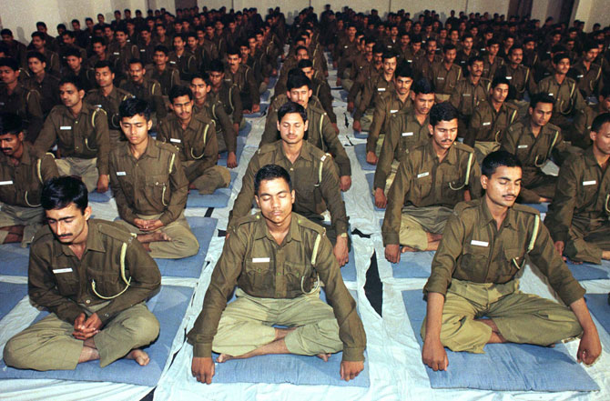 Policemen participate in a Vipassana meditation programme in Delhi