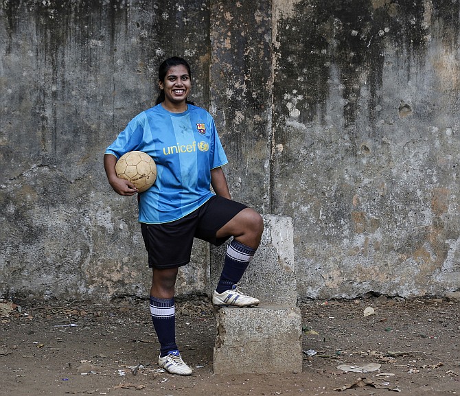 Rachel Blaekly, an 18-year-old student, poses during a football practice session at a playground in Mumbai.