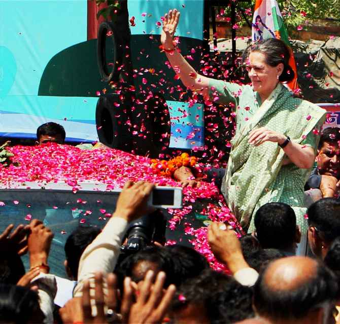 Sonia Gandhi waves to supporters before filing her nominations at Rae Bareli on Wednesday