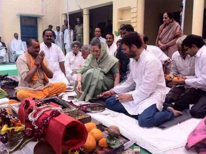 Congress president Sonia Gandhi and son Rahul at a havan in the party office in Rae Bareli