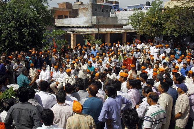 Crowds gather to hear General V K Singh in Ghaziabad's Arthala village.