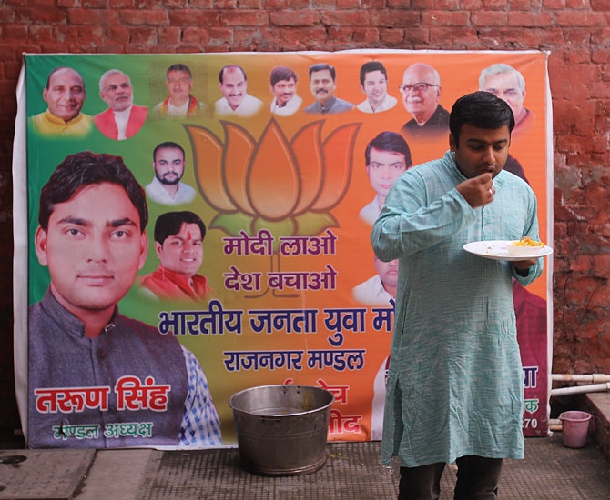 A BJP supporter eats breakfast at General V K Singh's temporary home in Ghaziabad.