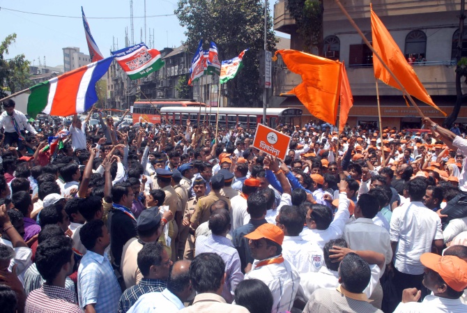 Shiv Sena supporters raise slogans outside the Old Custom House in Mumbai