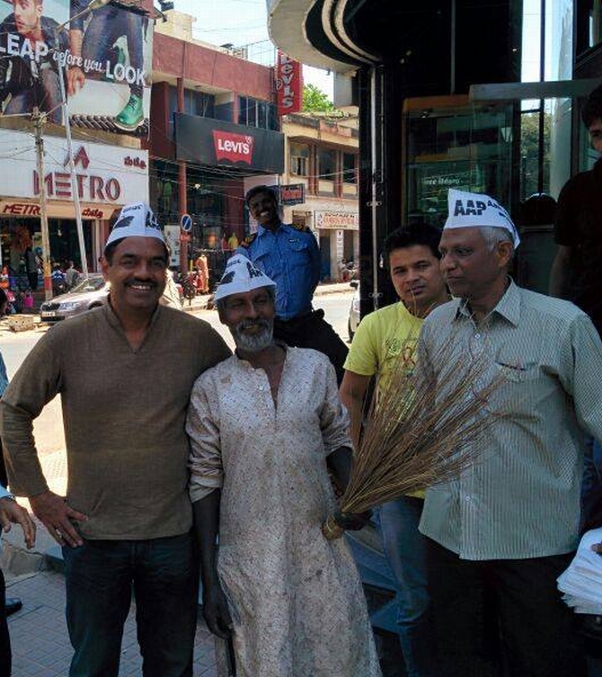 AAP's V Balakrishnan poses for shutterbugs in the middle of a hectic election campaign.