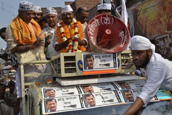 Arvind Kejriwal stands atop a jeep during a public rally in Varanasi.