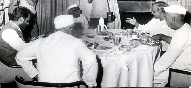 Prime Minister Morarji Desai, back to the camera, with Janata Party leaders.
