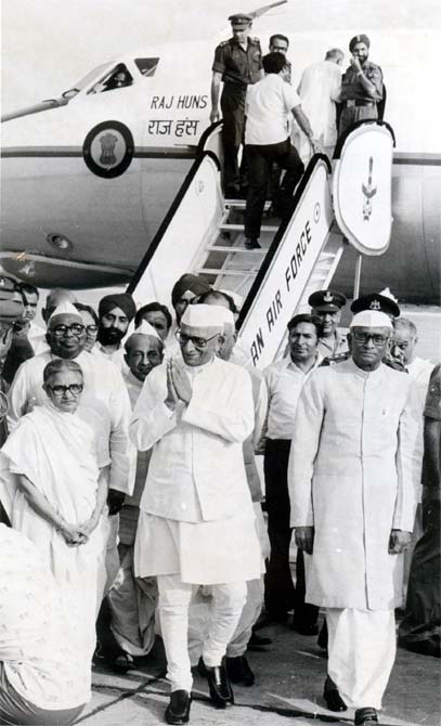 President Neelam Sanjeeva Reddy, right, and Vice-President B D Jatti, behind the prime minister, greet Morarji Desai after his escape in an air crash.
