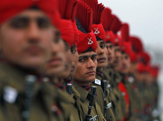 Indian Army recruits take part in their passing out parade at a garrison in Rangreth on the outskirts of Srinagar.