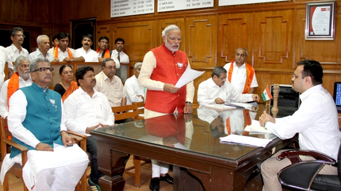 Bharatiya Janata Party's prime ministerial candidate Narendra Modi signing his nomination papers in Vadodara.