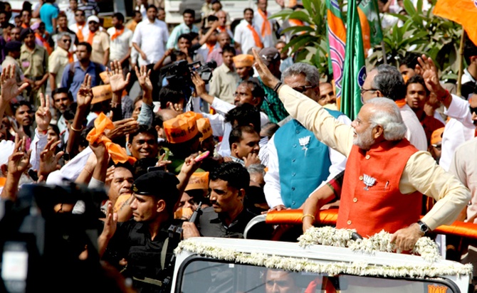 Modi at the road show that was attended by thousands of BJP workers and supporters in Vadodara.