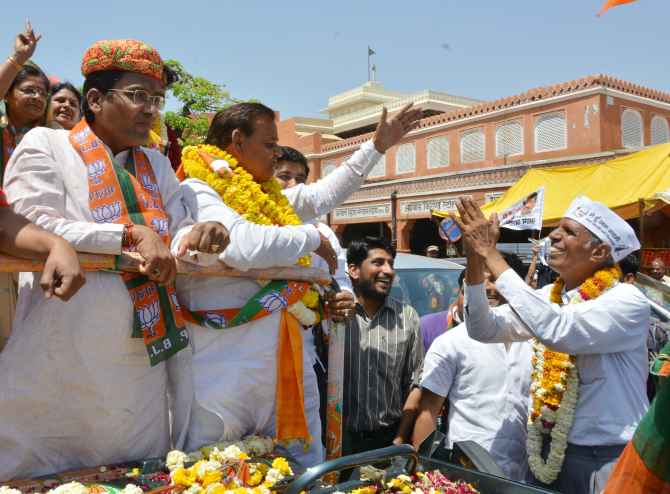 Dr Virendra Singh greets BJP candidate Ramcharan Bohra in Jaipur on Friday
