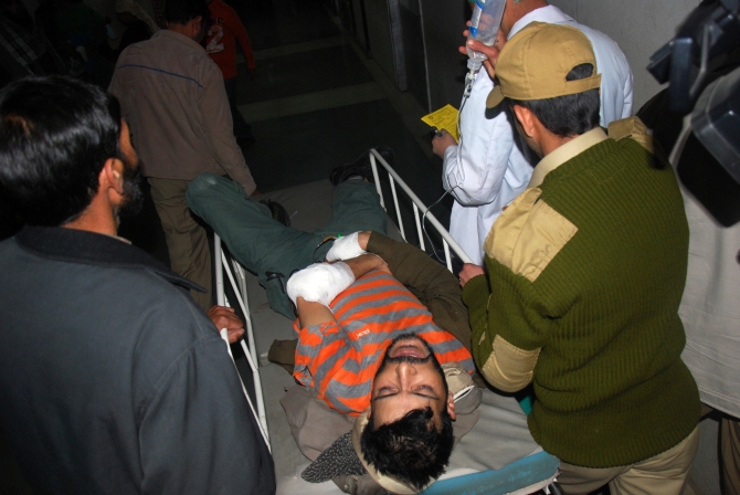 An injured policeman being rushed to the hospital