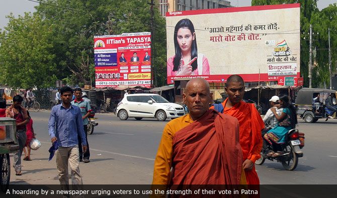 A hoarding by a newspaper urging voters to use the strength of their vote