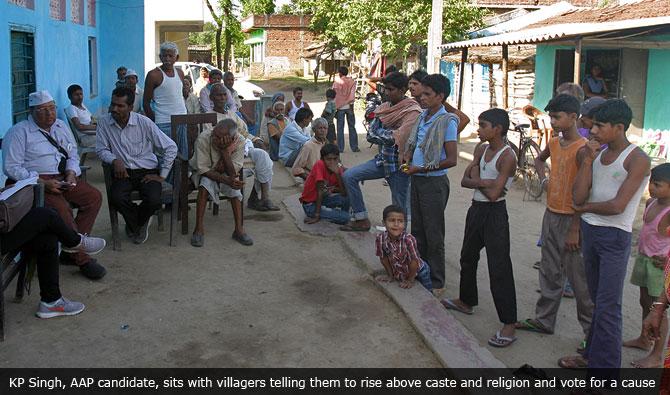  KP Singh, AAP candidate, sits with villagers telling them to rise above caste and religion and vote for a cause