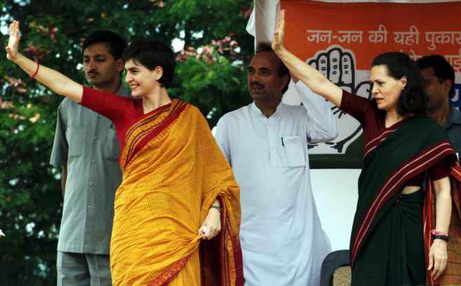 Priyanka Gandhi with Sonia Gandhi wave to supporters during a rally in Bellary ahead of the 1999 general elections