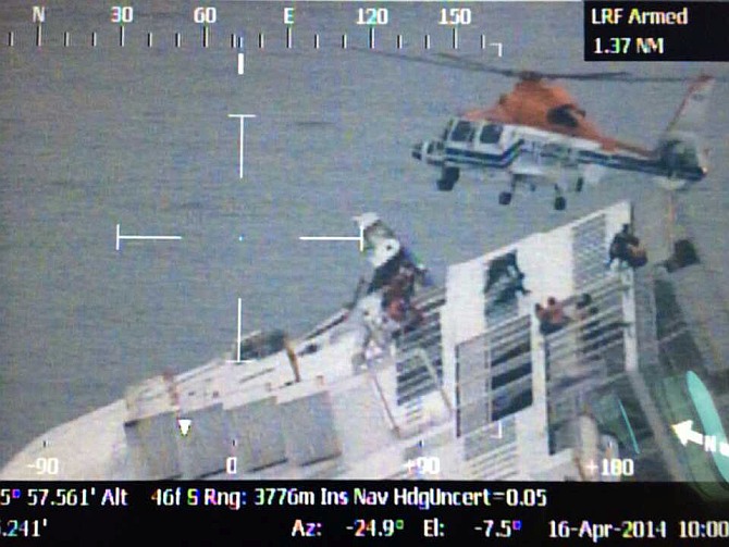 In this handout image provided by the Republic of Korea Coast Guard, rescue work by members of the Republic of Korea Coast Guard continues around the ferry sinking off the coast of Jindo Island