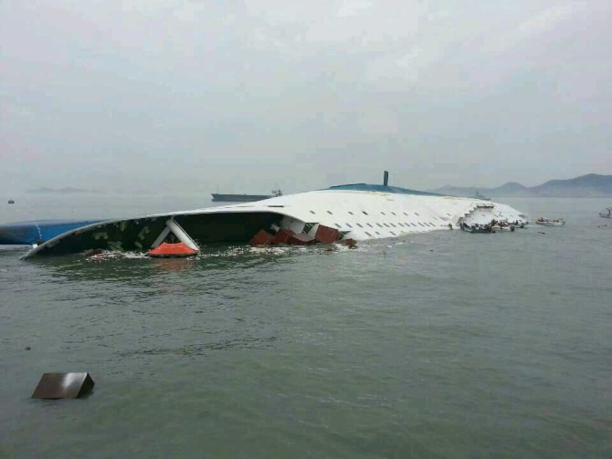 In this handout image provided by the Republic of Korea Coast Guard, a passenger ferry sinks off the coast of Jindo Islan