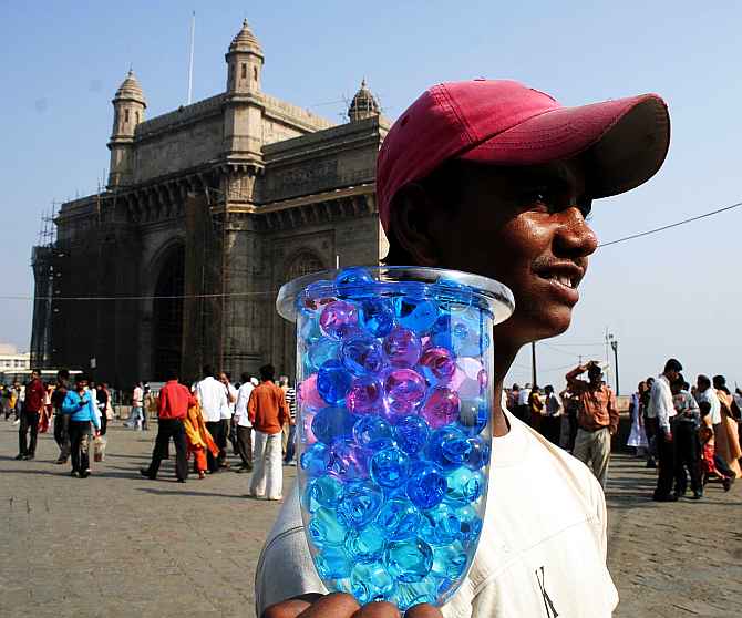 A vendor sells his wares at Gateway of India, a hot spot for tourists. 