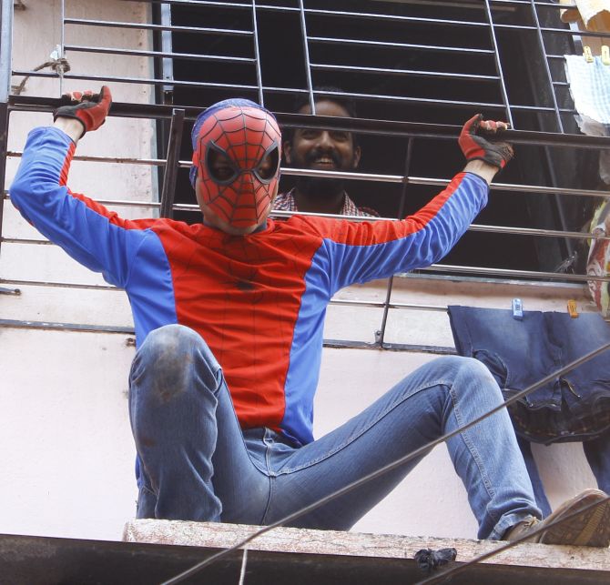 Indian Spider-Man Gaurav Sharma poses for a photograph during election campaigning in Girgaum, Mumbai.