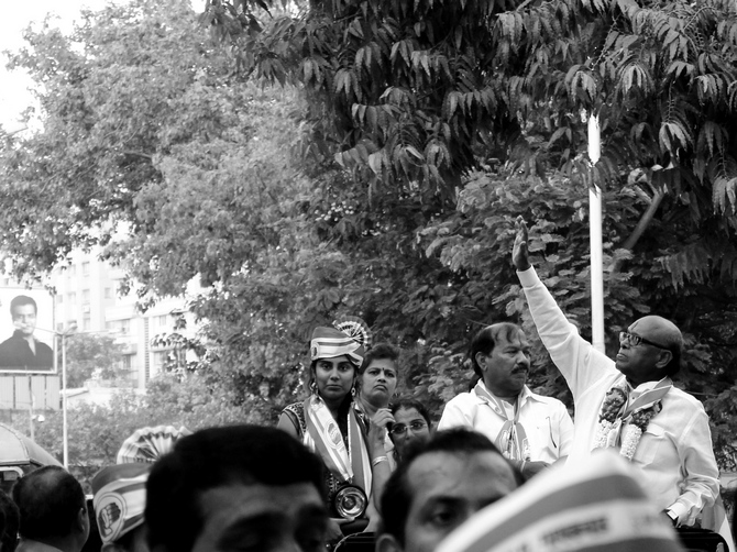 Eknath Gaikwad waves during a campaign rally in Dadar, central Mumbai, a bastion of the Shiv Sena.
