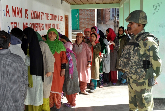 Women queue up to cast their votes in Srinagar