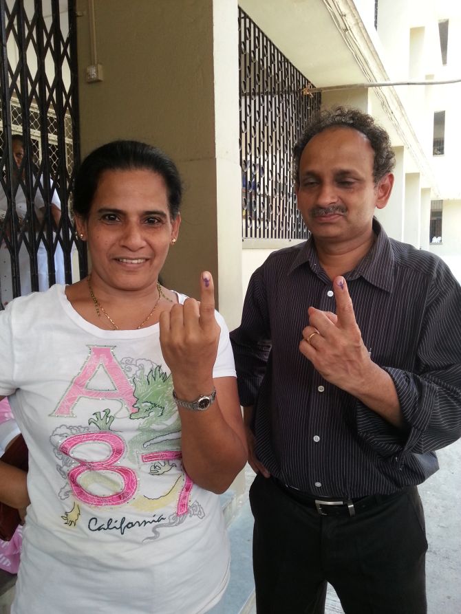 Lina Menezes and Lancy D'Souza flaunt their finger after voting.