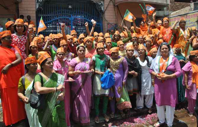 Women workers of BJP cheer for Modi in Varanasi on Thursday