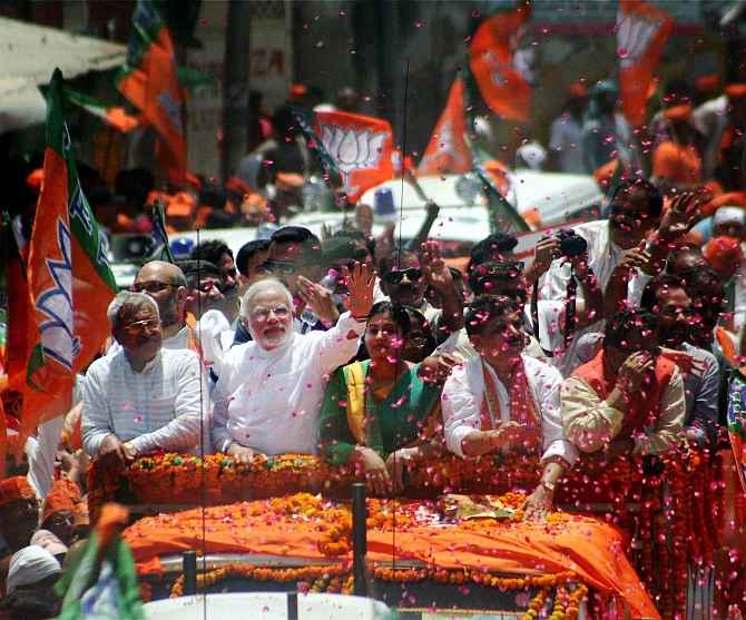 BJP prime ministerial candidate Narendra Modi waves at supporters
