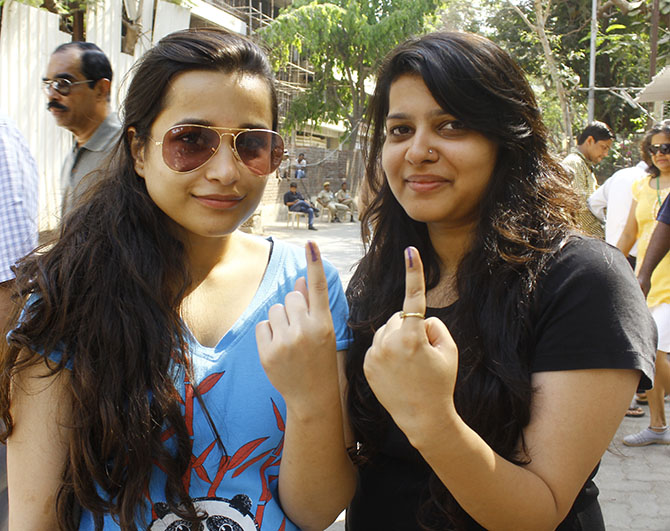 Youngsters pose after voting in Mumbai