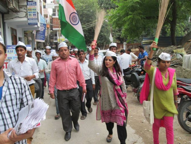Carrying her party's symbol, the broom, Shazia on a campaign trail in Delhi.