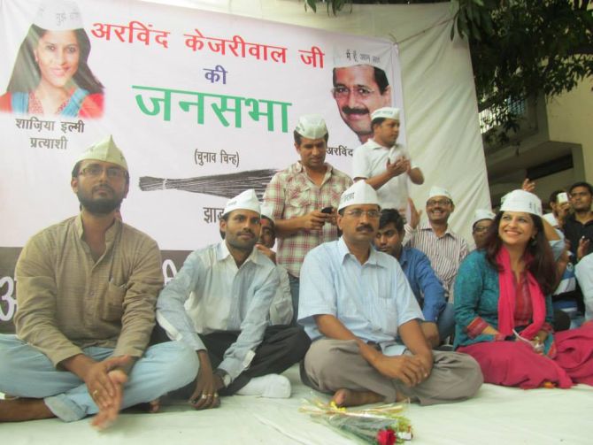 Shazia with AAP founder and chief Arvind Kejriwal during one of his public meetings in Delhi.