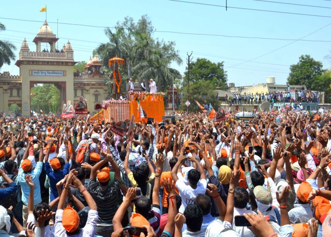 Modi pays floral tribute to Madan Mohan Malviya's statue in Varanasi.